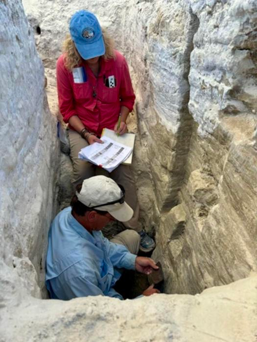 Kathleen Springer and Jeffrey Pigati collect samples for environmental change analysis from a trench in the White Sands playa, representing thousands of years of change at the site. Kathleen Springer and Jeffrey Pigati collect samples for environmental change analysis from a trench in the White Sands playa, representing thousands of years of change at the site.